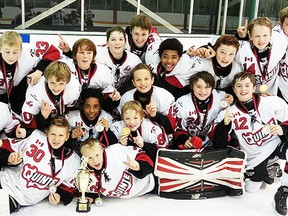 The Foley Bus Lines minor peewee Quinte Red Devils celebrate their Quinte Cup title last weekend at the QSC. (Submitted photo)