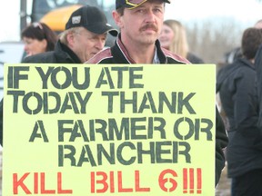 A man takes part in an anti-Bill 6 rally outside the Leduc Recreation Centre on Monday. (BOBBY ROY/Postmedia Network)
