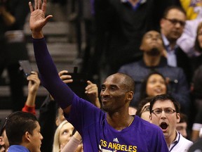 Lakers' Kobe Bryant waves to the crowd as he plays his last game at the Air Canada Centre in Toronto on Monday, Dec. 7, 2015. (Craig Robertson/Toronto Sun)