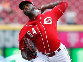 The trade involving the Reds sending relief pitcher Aroldis Chapman to the Dodgers is on hold due to an accusation in October of domestic violence, according to a report. (John Minchillo/AP Photo/Files)