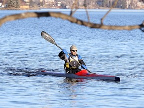 Avid paddler Paul Laine paddles his kayak on Ramsey Lake in Sudbury, Ont. on Monday December 7, 2015. The unseasonably warm temperatures have so far kept the lake from freezing over, the forecast for the week calls for temperatures above the freezing mark with rain.Gino Donato/Sudbury Star/Postmedia Network