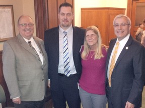 Sarnia-Lambton MPP Bob Bailey, left, stands with Patch for Patch program proponents Mike Howell, Laurie Hicks, and Nipissing MPP Vic Fedeli. Queen's Park voted to make the fentanyl patch exchange program law Monday with all-party support. (Handout/Sarnia Observer/Postmedia Network)