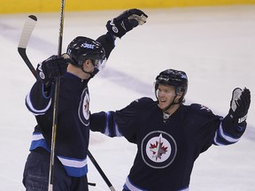 The two Winnipeg Jets defencemen share little in the way of physical similarity other than they are humans who both play professional hockey — Enstrom the shortest Jet at 5-foot-10 and Myers the towering 6-foot-8 rearguard who’s tall enough to post up in the NBA let alone anchor a professional hockey blue-line.