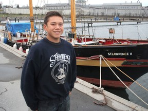 Saimaniq Temela, standing in front of the St. Lawrence II in Kingston, recently went on a three-week sail training voyage in the Arabian Gulf. (Michael Lea/The Whig-Standard)