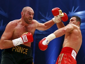 Tyson Fury is seen in action against Wladimir Klitschko during their heavyweight title fight at the Esprit Arena in Dusseldorf in this November 28, 2015 file photo. (REUTERS/Kai Pfaffenbach/Files)