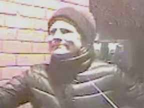 Toronto Police released this image of a woman sought in the theft of a Christmas wreath from the front door of a Summerhill home Dec. 5, 2015.