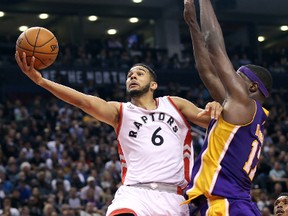 Raptors point guard Cory Joseph (left) goes to the basket and scores against the Lakers during NBA action on Monday, Dec. 7, 2015. (Tom Szczerbowski/USA TODAY Sports)