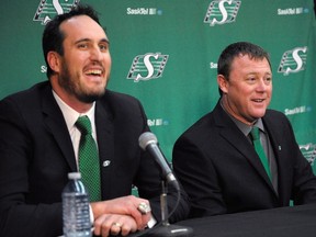 The new head coach and general manager of the Saskatchewan Roughriders Chris Jones (right) and team president and CEO Craig Reynolds attend a press conference at Mosaic Stadium in Regina on Monday. Jones recently led the Edmonton Eskimos to a Grey Cup victory.  (The Canadian Press)