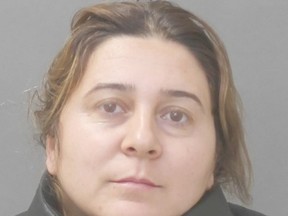 Mihaela Miclescu, 34, accused in distraction theft of senior's necklace.
