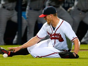 Shelby Miller of the Atlanta Braves attempts to make a play on a ground ball at Turner Field on September 10, 2015 in Atlanta. (Kevin C. Cox/Getty Images/AFP)