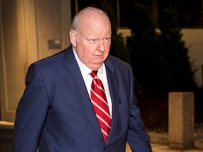 Senator Mike Duffy leaves the Ottawa Courthouse after testifying in his own defence at his trial in Ottawa on Tuesday, Dec. 8, 2015. Errol McGihon/Ottawa Sun/Postmedia Network
