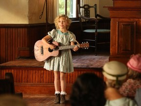 Alyvia Alyn Lind as a young Dolly Parton in "Dolly Parton's Coat of Many Colors."