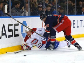 Montreal Canadiens winger Alexander Semin (13) and New York Rangers defenceman Marc Staal battle for the puck at Madison Square Garden. (Noah K. Murray/USA TODAY Sports)