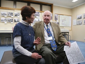 Fiske Hanley, right, of Fort Worth, Texas, an American Second World War veteran who took part in firebombing of Tokyo and was later held captive by the Japanese 70 years ago, and survivor Haruyo Nihei, left, talk at the Center of the Tokyo Raids and War Damage in Tokyo, on Dec. 9, 2015. (AP Photo/Eugene Hoshiko)