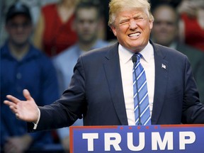 U.S. Republican presidential candidate Donald Trump reacts while addressing supporters at a Trump for President campaign rally in Raleigh, North Carolina Dec. 4, 2015.  REUTERS/Jonathan Drake