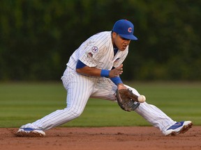 Chicago Cubs shortstop Starlin Castro fields a ground ball during Game 3 of the National League Division Series Monday, Oct. 12, 2015, in Chicago. (AP Photo/Paul Beaty)