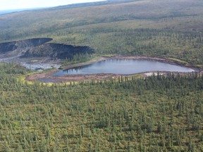 A lake, which has no name and sits in the Northwest Territories' northern corner near the community of Fort McPherson, is a victim of the region's geology and changing climate. In a dramatic example of how climate change is altering the Arctic landscape, the small northern lake has fallen off a cliff after bursting through the melting earthen rampart that restrained it. (THE CANADIAN PRESS/HO-Government of Northwest Territories)