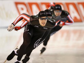 Canada's William Dutton leads his team to a first place finish in the men's team sprint at a World Cup speedskating event in Kearns, Utah, on Nov. 22, 2015. (George Frey/AP Photo)