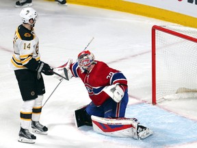 Canadiens goalie Mike Condon (39) allows a goal to the Bruins as right wing Brett Connolly (14) stands in front of the net during third period NHL action in Montreal on Wednesday, Dec. 9, 2015. (Jean-Yves Ahern/USA TODAY Sports)