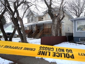 Police guards the scene where a man died while in custody at 12004 58 st in Edmonton, Alberta on December 8, 2015.  ASIRT is investigating the incident.
