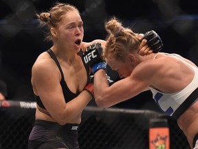 Ronda Rousey (red gloves) fights Holly Holm during UFC 193 at Etihad Stadium. (Matt Roberts/USA TODAY Sports)