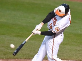 Chris Davis of the Baltimore Orioles hits a home run against the New York Yankees at Oriole Park at Camden Yards on October 4, 2015 in Baltimore. (Mitchell Layton/Getty Images/AFP)