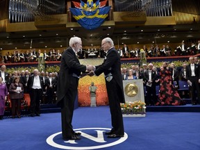 2015 Nobel physics laureate professor Arthur B. McDonald (L) of Canada receives his award from King Carl Gustaf of Sweden during the 2015 Nobel prize award ceremony in Stockholm Concert Hall December 10, 2015.  REUTERS/Jonas Ekstromer/TT News Agency
