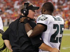 In this Sept. 9, 2013, file photo, Philadelphia Eagles coach Chip Kelly talks with then-Eagles running back LeSean McCoy along the sidelines during a game against the Washington Redskins in Landover, Md. (AP Photo/Alex Brandon, File)