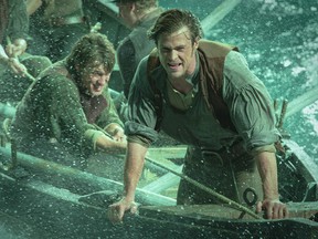 This photo provided by Warner Bros. Pictures shows, Chris Hemsworth, right, as Owen Chase, and Sam Keeley as Ramsdell, left, in a scene from the film, "In the Heart of the Sea." The movie opens in U.S. theaters on Dec. 11, 2015. (Jonathan Prime/Warner Bros. Pictures)