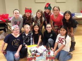 The Debbie McGonigle School of Dance Competitive Crew and Tap Team collected canned goods for the Salvation Army Food Bank at their quarter auction they held at the CBD Club on Dec. 2.