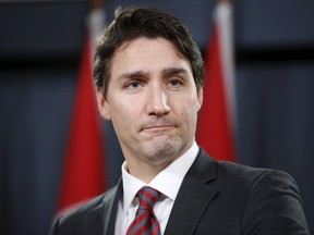 Canada's Prime Minister Justin Trudeau listens to a question during a news conference in Ottawa, Canada, December 9, 2015. REUTERS/Chris Wattie