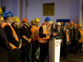 Minister of jobs and the economy Kevin Chief brings up CN workers to announce new contract with Amsted Rail that will bring CN 1 million wheels from Griffin Wheel Company on Dec. 10.