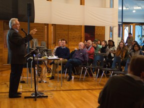 Darren Lezubski presenting the State of the Inner City report to an audience at Thunderbird House on Dec. 10.