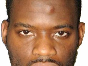 This is a an undated Metropolitan Police file handout photo of Michael Adebolajo  one of the two murderers of British soldier Lee Rigby who was killed in London in 2013.  Extremist Adebolajo who was convicted of fatally hacking British soldier Lee Rigby two years ago is suing prison officials over having his two front teeth knocked out. Michael Adebolajo seeks compensation for losing the teeth during a confrontation with prison personnel after his arrest but before his trial. (Metropolitan Police via AP)