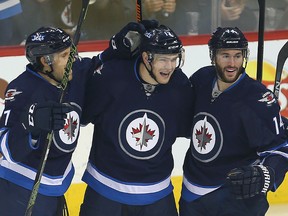 The Jets celebrate one of their six goals against the Blue Jackets on Thursday. (BRIAN DONOGH/Winnipeg Sun)
