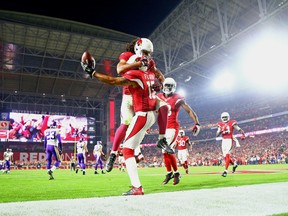 Cardinals wide receiver Michael Floyd (15) celebrates a touchdown with Larry Fitzgerald during second half NFL action against the Vikings in Glendale, Ariz., on Thursday, Dec. 10, 2015. (Mark J. Rebilas/USA TODAY Sports)