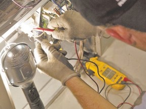 Measuring the power running through a switch is part of annual furnace maintenance.