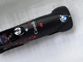 Canadian bobsleders Kaillie Humphries and Melissa Lotholz win the women’s World Cup race at Lake Koenigssee, Germany, Friday Dec. 11, 2015. (Tobias Hase/dpa via AP)