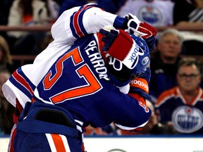 Edmonton Oilers' David Perron fights New York Rangers' Daniel Carcillo during third period NHL action at Rexall Place in Edmonton, on Sunday, March 30, 2014. (Perry Mah/Edmonton Sun file photo)