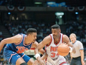 In this April 29, 1992 file photo, New Jersey Nets Chris Morris, right, looks for an opening around Cleveland Cavaliers John Williams during first-round NBA playoff action at the Meadowlands Arena, in East Rutherford, N.J. (AP Photo/Susan Ragan, File)