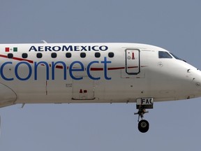 An Aeromexico aeroplane flies before landing on the airstrip at Benito Juarez international airport in Mexico City, July 8, 2015. REUTERS/Edgard Garrido