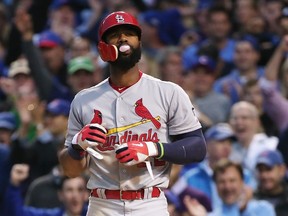 Jason Heyward of the St. Louis Cardinals reacts after striking out in the seventh inning against the Chicago Cubs during Game 4 of the National League Division Series at Wrigley Field in Chicago on Oct. 13, 2015. (Jonathan Daniel/Getty Images/AFP)