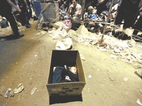 A Syrian refugee baby sleeps in a box at Greece?s border with Macedonia. The family of Jesus was in a similar situation to today?s refugees. (Yannis Behrakis /Reuters file photo)