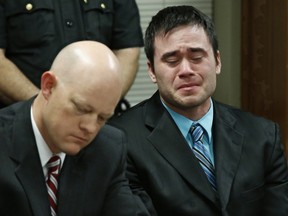 Daniel Holtzclaw, right, cries as the verdicts are read in his trial in Oklahoma City, Thursday, Dec. 10, 2015. At left is defense attorney Robert Gray. (AP Photo/Sue Ogrocki, Pool)