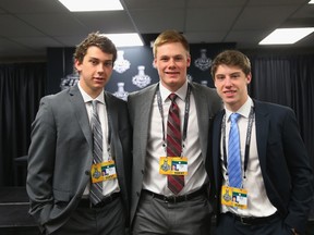Dylan Strome (left), Lawson Crouse (middle) and Mitch Marner take part in a media availability at United Center on June 8, 2015 in Chicago. The three will form Canada’s top line at the world junior tournament. (Bruce Bennett/Getty Images/AFP)