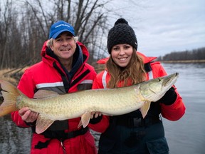 John Anderson of the Ottawa River Musky Factory along with author Ashley Rae and her muskie. Photo by Eric Riley.