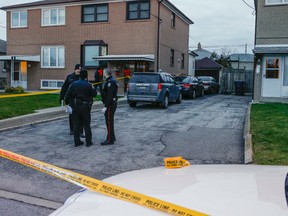 Officers are pictured at a residence on Coquette Rd. in the Jane St.-Sheppard Ave. area where Toronto Police shot a 31-year-old man. (DAVE THOMAS, Toronto Sun)