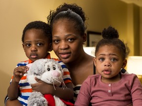 Bernadette Tshisuaka with her two and a half year-old twins Jeremiah and Neva are all fine after surviving a house fire last Saturday. Friday December 11, 2015. 
Errol McGihon/Ottawa Sun