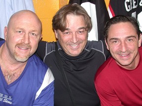 Longtime Intelligencer advertising sales rep and local rec hockey goalie, Don Sutherland (middle), got the thrill of a lifetime when he dressed for the Scotiabank NHL Alumni Team for a charity exhibition game Friday night at Yardmen Arena. Flanking Sutherland, from left, are former OHL Belleville Bulls Al Iafrate and Brent Gretzky. (Paul Svoboda/The Intelligencer)