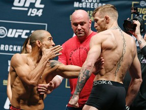 UFC president Dana White (center) stands between Jose Aldo (left) and Conor McGregor (right) during the weigh-in for UFC 194 in Las Vegas on Friday, Dec. 11, 2015. (John Locher/AP Photo)